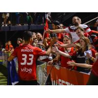 Junior Burgos of the Atlanta Silverbacks High Fives the Fans