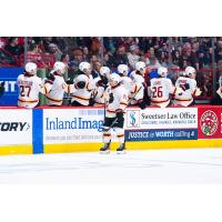 Vancouver Giants' Cameron Schmidt congratulated by team