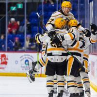 Wheeling Nailers' Phip Waugh, Matt Quercia, and Jordan Martel celebrate win