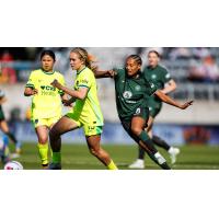 Racing Louisville FC midfielder Ary Borges (right) moves in against the Washington Spirit
