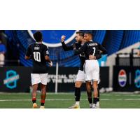 Phoenix Rising FC's Hope Avayevu, Dariusz Formella, and Jearl Margaritha on game night